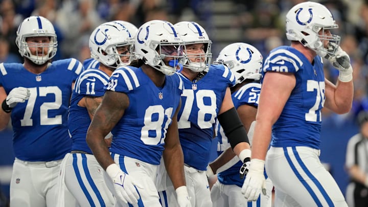 Indianapolis Colts players including Indianapolis Colts center Ryan Kelly (78) walk on the field