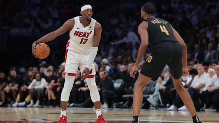 Apr 26, 2025; Miami, Florida, USA; Miami Heat center Bam Adebayo (13) dribbles the basketball as Cleveland Cavaliers forward Evan Mobley (4) defends in the third quarter during game three for the first round of the 2025 NBA Playoffs at Kaseya Center. Mandatory Credit: Sam Navarro-Imagn Images
