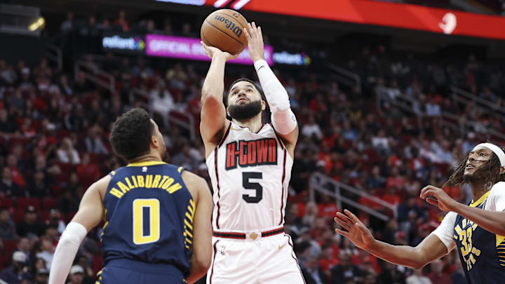 Nov 20, 2024; Houston, Texas, USA; Houston Rockets guard Fred VanVleet (5) shoots the ball as Indiana Pacers guard Tyrese Haliburton (0) defends during the second quarter at Toyota Center. Mandatory Credit: Troy Taormina-Imagn Images