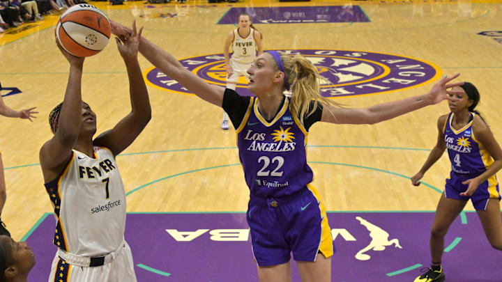 May 24, 2024; Los Angeles, California, USA;  Los Angeles Sparks forward Cameron Brink (22) blocks a shot by Indiana Fever forward Aliyah Boston (7) in the first half at Crypto.com Arena. Mandatory Credit: Jayne Kamin-Oncea-Imagn Images