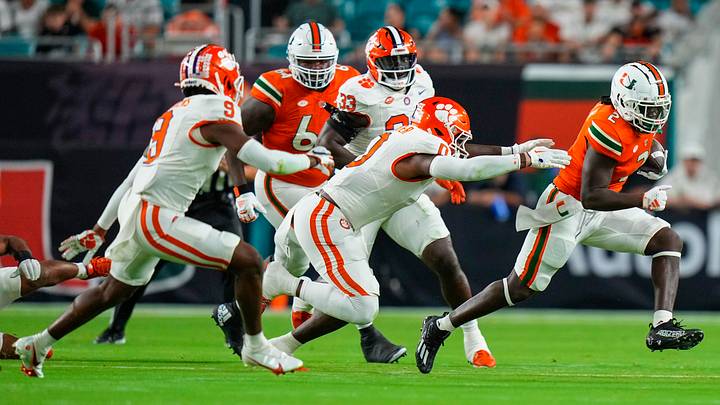 Oct 21, 2023; Miami Gardens, Florida, USA; Miami Hurricanes running back Donald Chaney Jr. (2) runs the ball against the Clemson Tigers during the first quarter at Hard Rock Stadium. Mandatory Credit: Rich Storry-USA TODAY Sports