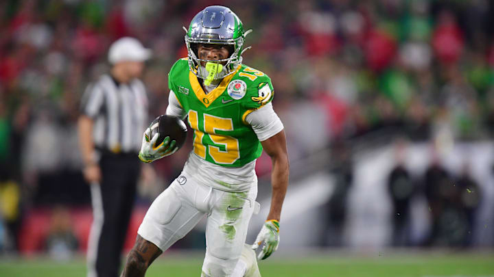 Jan 1, 2025; Pasadena, CA, USA; Oregon Ducks wide receiver Tez Johnson (15) runs against the Ohio State Buckeyes in the second half in the 2025 Rose Bowl college football quarterfinal game at Rose Bowl Stadium. Jan 1, 2025; Pasadena, CA, USA; Oregon Ducks wide receiver Tez Johnson (15) runs against the Ohio State Buckeyes in the second half in the 2025 Rose Bowl college football quarterfinal game at Rose Bowl Stadium.