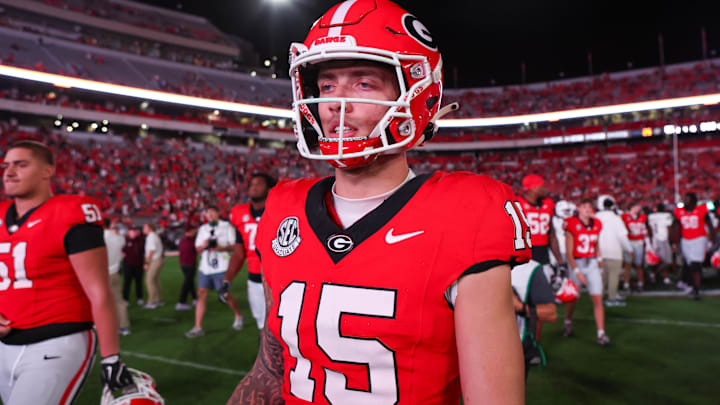 Georgia Bulldogs quarterback Carson Beck (15) walks off the field after a victory over the Mississippi State Bulldogs.
