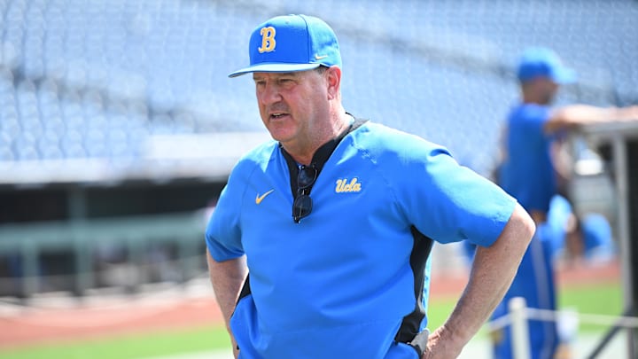 Jun 14, 2025; Omaha, Neb, USA;  UCLA Bruins head coach John Savage on the field before the game against the Murray State Races at Charles Schwab Field. Mandatory Credit: Steven Branscombe-Imagn Images