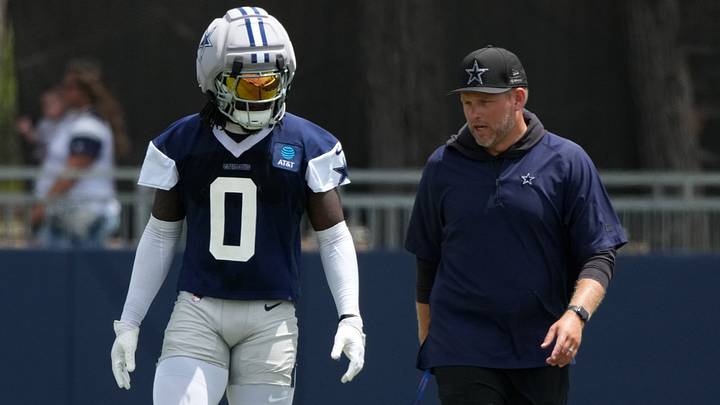 Dallas Cowboys linebacker DeMarvion Overshown (0) talks with inside linebackers coach Scott Symons at training camp at River Ridge Playing Fields. Mandatory Credit: Kirby Lee-Imagn Images Dallas Cowboys linebacker DeMarvion Overshown (0) talks with inside linebackers coach Scott Symons at training camp at River Ridge Playing Fields. Mandatory Credit: Kirby Lee-Imagn Images