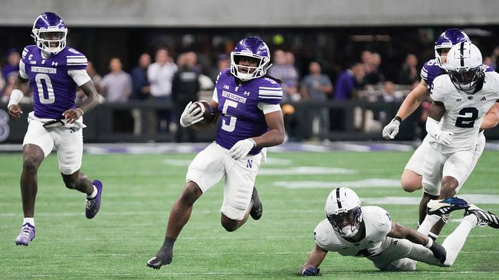 Northwestern Wildcats running back Caleb Komolafe (5) runs the ball against the Penn State Nittany Lions during the second half at New Ryan Field. Northwestern Wildcats running back Caleb Komolafe (5) runs the ball against the Penn State Nittany Lions during the second half at New Ryan Field.