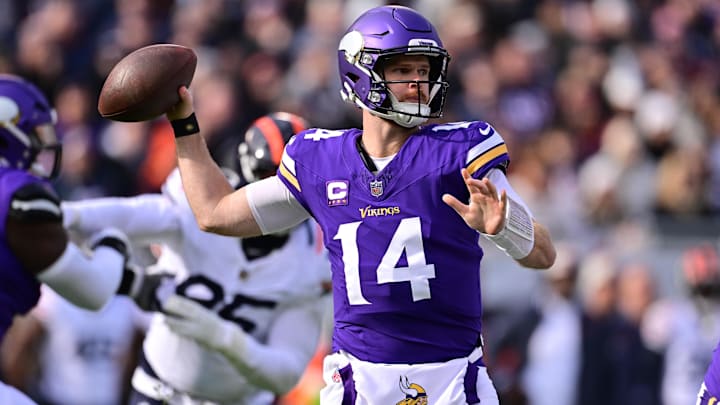 Nov 24, 2024; Chicago, Illinois, USA; Minnesota Vikings quarterback Sam Darnold (14) passes the ball against the Chicago Bears during the first quarter at Soldier Field. Nov 24, 2024; Chicago, Illinois, USA; Minnesota Vikings quarterback Sam Darnold (14) passes the ball against the Chicago Bears during the first quarter at Soldier Field.