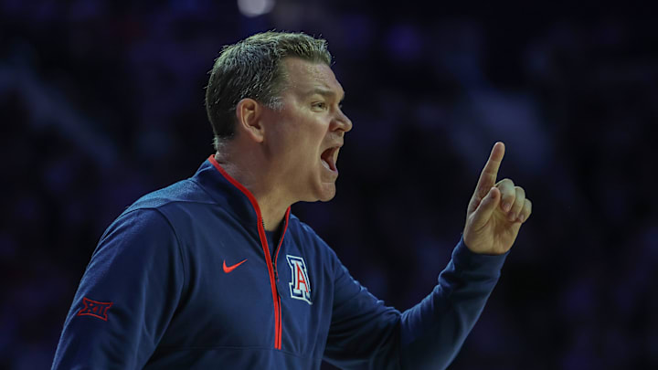 Feb 11, 2025; Manhattan, Kansas, USA; Arizona Wildcats head coach Tommy Lloyd yells at his team during the first half against the Kansas State Wildcats at Bramlage Coliseum. Mandatory Credit: Scott Sewell-Imagn Images Feb 11, 2025; Manhattan, Kansas, USA; Arizona Wildcats head coach Tommy Lloyd yells at his team during the first half against the Kansas State Wildcats at Bramlage Coliseum. Mandatory Credit: Scott Sewell-Imagn Images