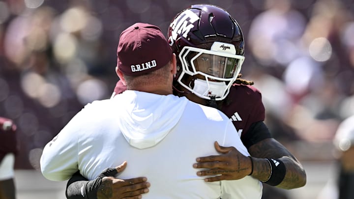 Texas A&M Aggies head coach Mike Elko greets cornerback Will Lee III (4) prior to the game against the Auburn Tigers at Kyle Field. Texas A&M Aggies head coach Mike Elko greets cornerback Will Lee III (4) prior to the game against the Auburn Tigers at Kyle Field.