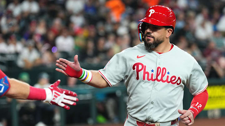 Sep 20, 2025; Phoenix, Arizona, USA; Philadelphia Phillies outfielder Kyle Schwarber (12) celebrates after scoring a run against the Arizona Diamondbacks during the first inning at Chase Field. Mandatory Credit: Joe Camporeale-Imagn Images