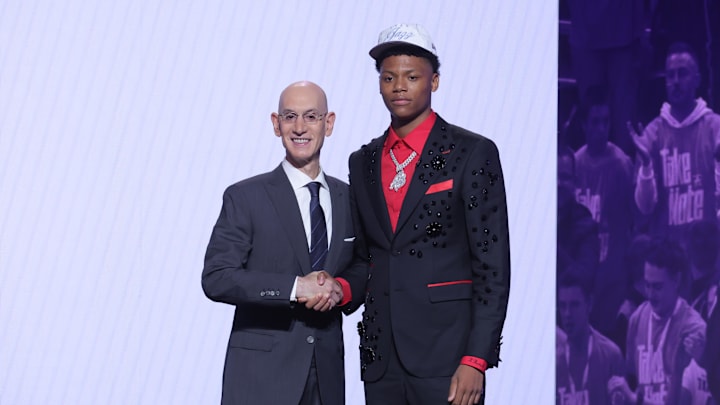 Jun 25, 2025; Brooklyn, NY, USA;  Ace Bailey stands with NBA commissioner Adam Silver after being selected as the fifth pick by the Utah Jazz in the first round of the 2025 NBA Draft at Barclays Center. Mandatory Credit: Brad Penner-Imagn Images