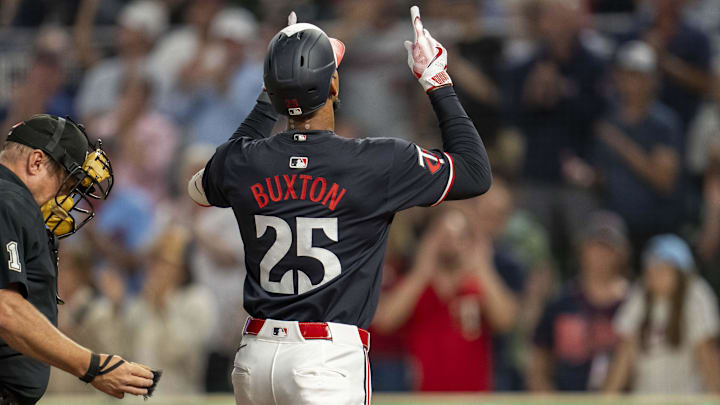 Sep 25, 2024; Minneapolis, Minnesota, USA; Minnesota Twins center fielder Byron Buxton (25) celebrates after hitting a solo home run against the Miami Marlins in the fourth inning at Target Field.