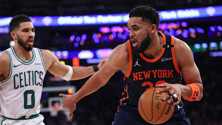 May 12, 2025; New York, New York, USA; New York Knicks center Karl-Anthony Towns (32) is guarded by Boston Celtics forward Jayson Tatum (0) in the first half during game four of the second round for the 2025 NBA Playoffs at Madison Square Garden. Mandatory Credit: Vincent Carchietta-Imagn Images