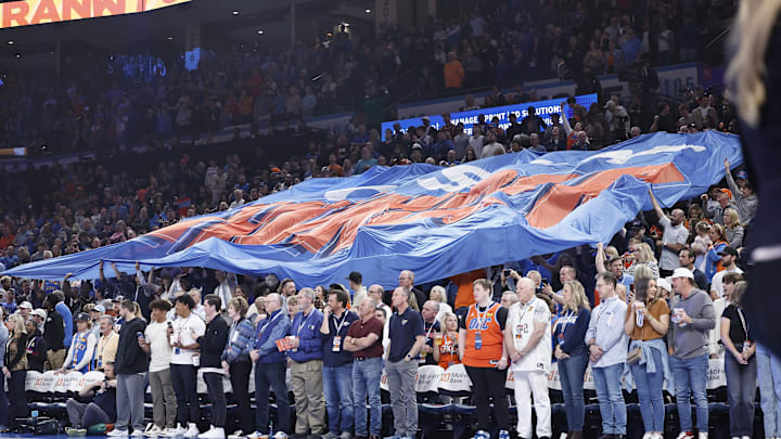 Mar 29, 2024; Oklahoma City, Oklahoma, USA; Oklahoma City Thunder fans pass a giant flag through the crowd before the start of a game against the Phoenix Suns at Paycom Center. Mandatory Credit: Alonzo Adams-Imagn Images