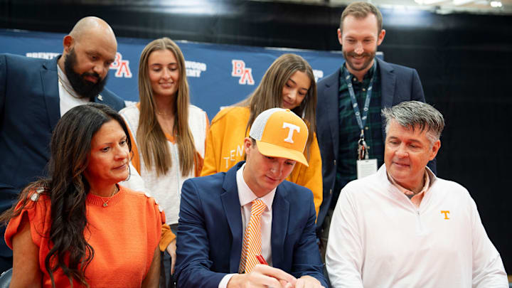 George MacIntyre sits with his family during signing day at Brentwood High School in Brentwood, Tenn., Wednesday, Dec. 4, 2024.