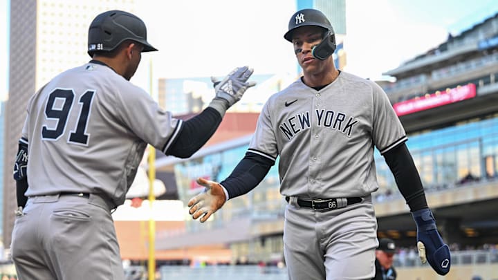 Apr 25, 2023; Minneapolis, Minnesota, USA; New York Yankees center fielder Aaron Judge (99) celebrates with second baseman Oswald Peraza (91) after scoring a run on a single by third baseman DJ LeMahieu during the first inning at Target Field. Mandatory Credit: Jeffrey Becker-Imagn Images Apr 25, 2023; Minneapolis, Minnesota, USA; New York Yankees center fielder Aaron Judge (99) celebrates with second baseman Oswald Peraza (91) after scoring a run on a single by third baseman DJ LeMahieu during the first inning at Target Field. Mandatory Credit: Jeffrey Becker-Imagn Images