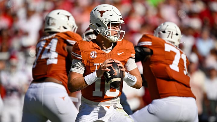 Oct 11, 2025; Dallas, Texas, USA; Texas Longhorns quarterback Arch Manning (16) looks to throw the ball during the game between the Texas Longhorns and the Oklahoma Sooners at the Cotton Bowl. Mandatory Credit: Jerome Miron-Imagn Images