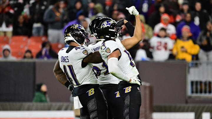 Nov 16, 2025; Cleveland, Ohio, USA;  Baltimore Ravens safety Kyle Hamilton (14) and cornerback Marlon Humphrey (44) celebrate a sack during the third quarter against the Cleveland Browns at Huntington Bank Field. Mandatory Credit: Ken Blaze-Imagn Images