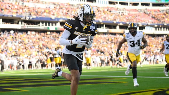 Dec 30, 2024; Nashville, TN, USA;  Missouri Tigers wide receiver Marquis Johnson (2) makes a catch for a touchdown against the Iowa Hawkeyes  during the first half at Nissan Stadium. Mandatory Credit: Steve Roberts-Imagn Images