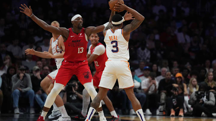Dec 7, 2024; Miami, Florida, USA;  Miami Heat center Bam Adebayo (13) pressures Phoenix Suns guard Bradley Beal (3) during the second half at Kaseya Center. Mandatory Credit: Jim Rassol-Imagn Images