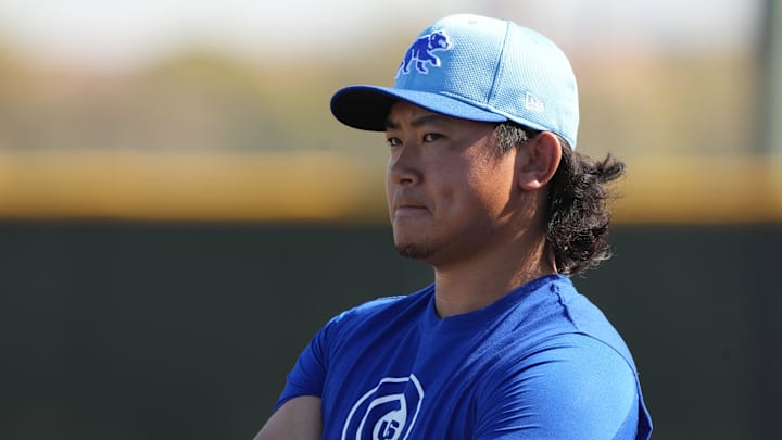 Feb 10, 2025; Mesa, AZ, USA; Chicago Cubs pitcher Shota Imanaga (18) runs through drills during spring training camp. 
