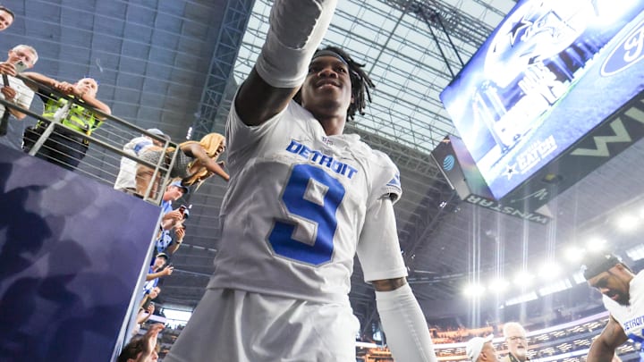 Detroit Lions wide receiver Jameson Williams (9) celebrates with fans after the game against the Dallas Cowboys Detroit Lions wide receiver Jameson Williams (9) celebrates with fans after the game against the Dallas Cowboys