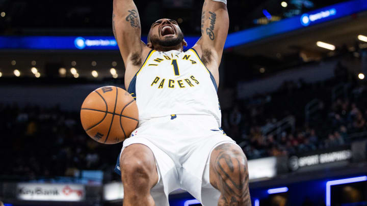 Oct 16, 2023; Indianapolis, Indiana, USA; Indiana Pacers forward Obi Toppin (1) slam dunks the ball in the second half against the Atlanta Hawks at Gainbridge Fieldhouse. Mandatory Credit: Trevor Ruszkowski-USA TODAY Sports