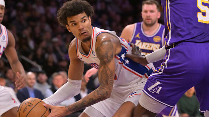 Feb 5, 2026; Los Angeles, California, USA;  Philadelphia 76ers forward Dominick Barlow (25) is defended by Los Angeles Lakers center Deandre Ayton (5) in the first half at Crypto.com Arena. Mandatory Credit: Jayne Kamin-Oncea-Imagn Images