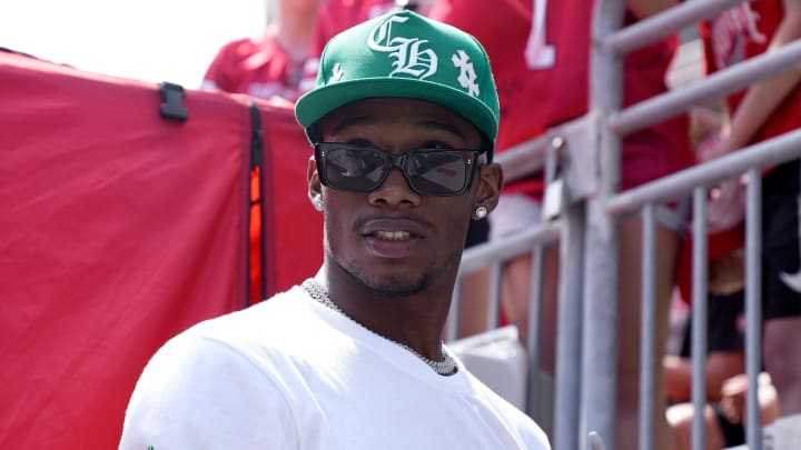 Garrett Wilson signs autographs for fans during the Ohio State spring football game