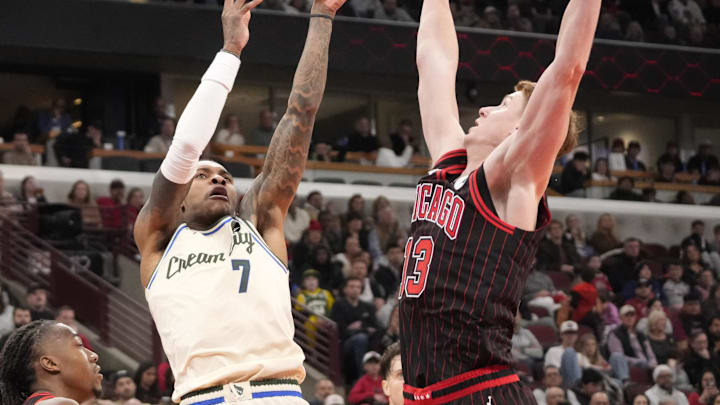 Dec 27, 2025; Chicago, Illinois, USA; Chicago Bulls guard Kevin Huerter (13) defends Milwaukee Bucks guard Kevin Porter Jr. (7) during the second half at United Center. Mandatory Credit: David Banks-Imagn Images