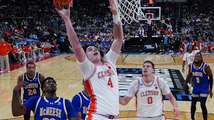 Mar 20, 2025; Providence, RI, USA; Clemson Tigers forward Ian Schieffelin (4) shoots a layup against McNeese State Cowboys guard Brandon Murray (23) during the first half at Amica Mutual Pavilion. Mandatory Credit: Gregory Fisher-Imagn Images
