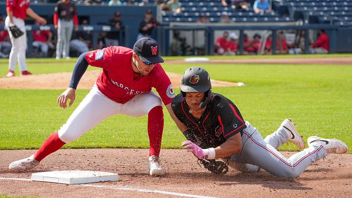 Rochester’s Trey Lipscomb is picked off by Worcester first baseman Brett Harris, getting the throw from catcher Jason Delay, July 8 at Polar Park.