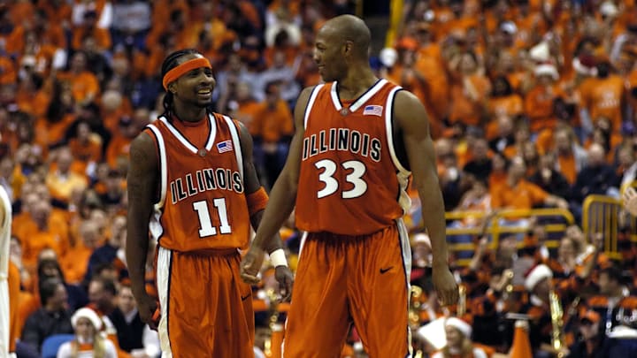 Dec 21, 2005; St. Louis, MO, USA;  Illinois guard Dee Brown (11) and guard Rich McBride (33) share a laugh during a timeout against Missouri during the second half at the Savvis Center in St. Louis, MO. Illinois defeated Missouri 82-50. Mandatory Credit:Scott Rovak-Imagn Images Copyright © Scott Rovak