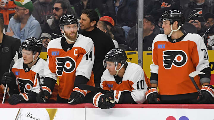 Apr 15, 2025; Philadelphia, Pennsylvania, USA; Philadelphia Flyers right wing Matvei Michkov (39), center Sean Couturier (14), right wing Bobby Brink (10) and right wing Tyson Foerster (71) watch the final seconds of loss to the Columbus Blue Jackets during the third period at Wells Fargo Center. 