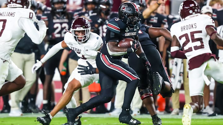 Nov 2, 2024; Columbia, South Carolina, USA; South Carolina Gamecocks running back Raheim Sanders (5) rushes against the Texas A&M Aggies in the first quarter at Williams-Brice Stadium. Mandatory Credit: Jeff Blake-Imagn Images