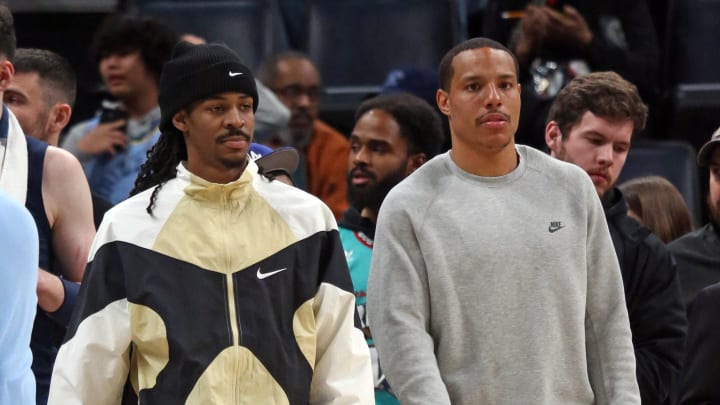 Mar 1, 2024; Memphis, Tennessee, USA; Memphis Grizzlies guard Ja Morant (left) and guard Desmond Bane (right) watch from the bench during the second half against the Portland Trail Blazers at FedExForum. Mandatory Credit: Petre Thomas-USA TODAY Sports