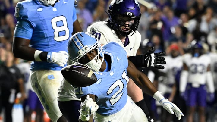 Sep 1, 2025; Chapel Hill, North Carolina, USA; North Carolina Tar Heels defensive back Kaleb Cost (21) intercepts a pass in the second quarter at Kenan Stadium. 