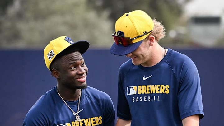 Milwaukee Brewers outfielder Luis Lara and infielder Cooper Pratt come off the field together during spring training workouts Monday, February 17, 2025, at American Family Fields of Phoenix in Phoenix, Arizona.