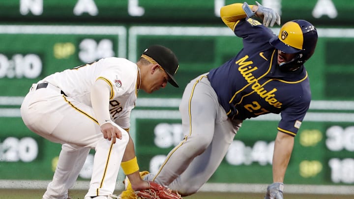 Milwaukee Brewers shortstop Willy Adames (27) steals second base ahead of a tag attempt by Pittsburgh Pirates second baseman Nick Gonzales (left) during the second inning at PNC Park. 