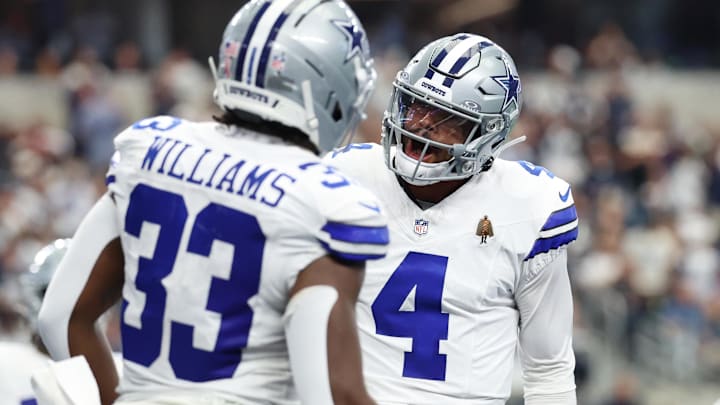 Dallas Cowboys running back Javonte Williams celebrates with quarterback Dak Prescott after scoring a touchdown against the New York Giants 
