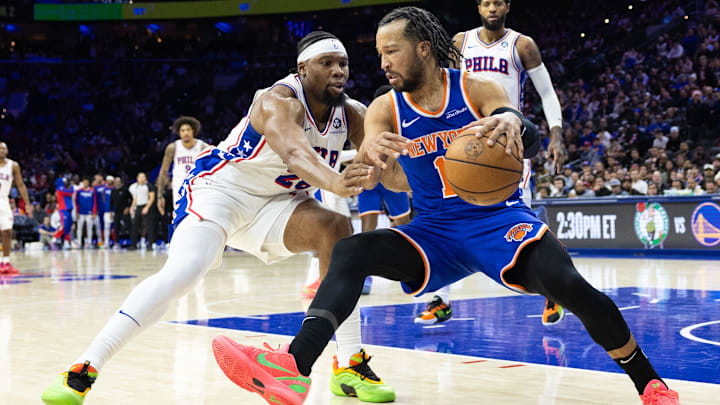Jan 15, 2025; Philadelphia, Pennsylvania, USA; New York Knicks guard Jalen Brunson (11) controls the ball against Philadelphia 76ers forward Guerschon Yabusele (28) during the fourth quarter at Wells Fargo Center. Mandatory Credit: Bill Streicher-Imagn Images