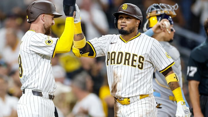 Sep 23, 2025; San Diego, California, USA; San Diego Padres designated hitter Luis Arraez (4) celebrates with second baseman Mason McCoy (18) after hitting a two-run home run during the second inning against the Milwaukee Brewers at Petco Park. Mandatory Credit: David Frerker-Imagn Images Sep 23, 2025; San Diego, California, USA; San Diego Padres designated hitter Luis Arraez (4) celebrates with second baseman Mason McCoy (18) after hitting a two-run home run during the second inning against the Milwaukee Brewers at Petco Park. Mandatory Credit: David Frerker-Imagn Images