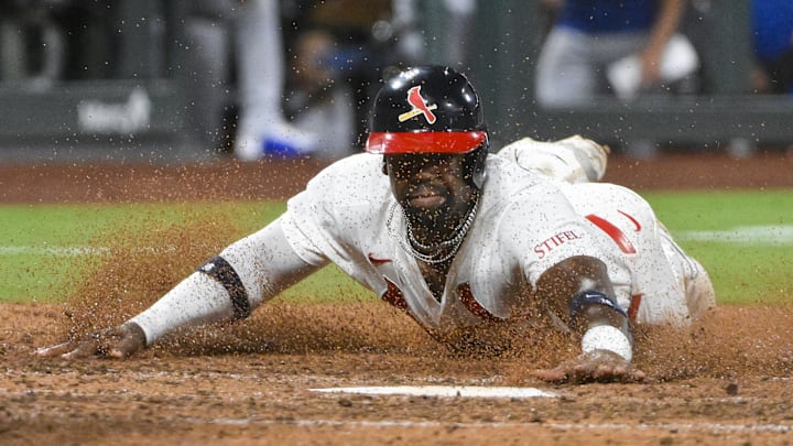 Aug 10, 2025; St. Louis, Missouri, USA;  St. Louis Cardinals right fielder Jordan Walker (18) slides head first to score against the Chicago Cubs during the seventh inning at Busch Stadium. Mandatory Credit: Jeff Curry-Imagn Images