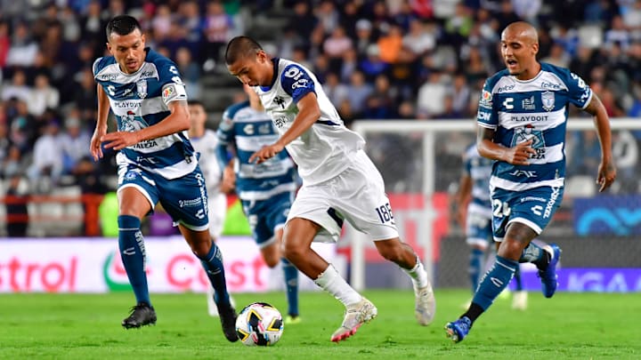 Pachuca's Gustavo Cabral (left) and Luis Rodríguez (right) give chase to Monterrey's Alessandro Tagle in Liga MX action on Sunday. The Tuzos lost their season opener 1-0.
