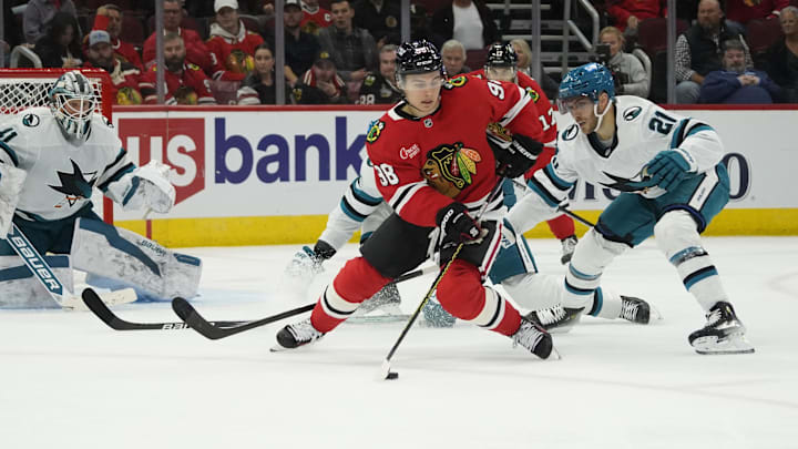 Oct 17, 2024; Chicago, Illinois, USA; San Jose Sharks center Alexander Wennberg (21) defends Chicago Blackhawks center Connor Bedard (98) during the third period at United Center. Mandatory Credit: David Banks-Imagn Images Oct 17, 2024; Chicago, Illinois, USA; San Jose Sharks center Alexander Wennberg (21) defends Chicago Blackhawks center Connor Bedard (98) during the third period at United Center. Mandatory Credit: David Banks-Imagn Images