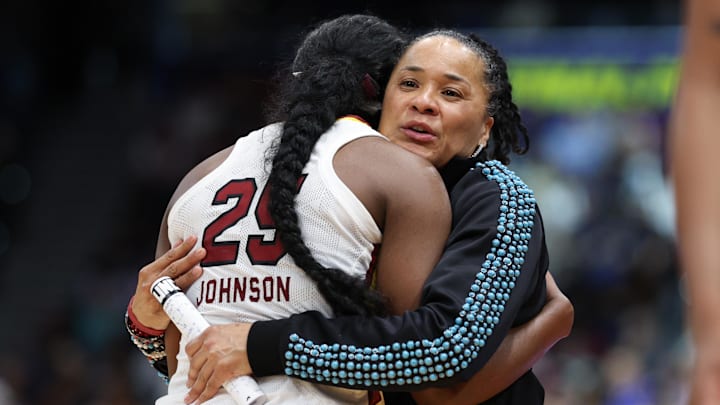 Apr 6, 2025; Tampa, FL, USA; South Carolina Gamecocks head coach Dawn Staley hugs guard Raven Johnson (25) during the second half of the national championship of the women's 2025 NCAA tournament at Amalie Arena. Mandatory Credit: Nathan Ray Seebeck-Imagn Images
