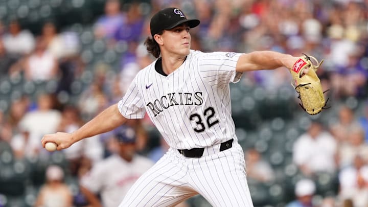 Jul 1, 2025; Denver, Colorado, USA; Colorado Rockies starting pitcher Chase Dollander (32) delivers a pitch against the Houston Astros in the first inning at Coors Field. 