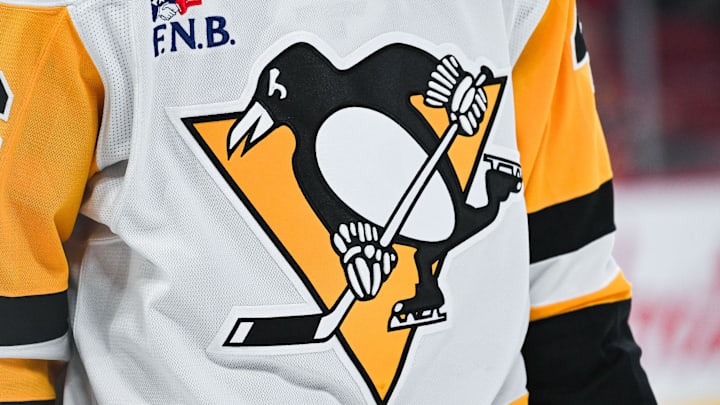 Dec 12, 2024; Montreal, Quebec, CAN; View of a Pittsburgh Penguins logo on a jersey worn by a member of the team during the second period at Bell Centre. Mandatory Credit: David Kirouac-Imagn Images