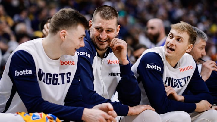 Jan 21, 2025; Denver, Colorado, USA; Denver Nuggets center Nikola Jokic (15) talks with guard Christian Braun (0) and forward Hunter Tyson (5) in the fourth quarter against the Philadelphia 76ers at Ball Arena. Mandatory Credit: Isaiah J. Downing-Imagn Images