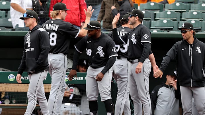 Chicago White Sox pitcher Jonathan Cannon (48) congratulated by teammates after defeating the Athletics at Sutter Health Park. 